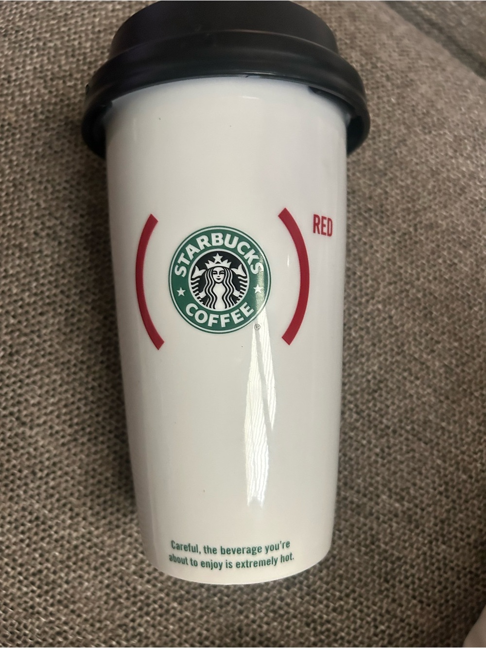 Starbucks 2010 Red Hope product partner ceramic travel mug with snap on lid